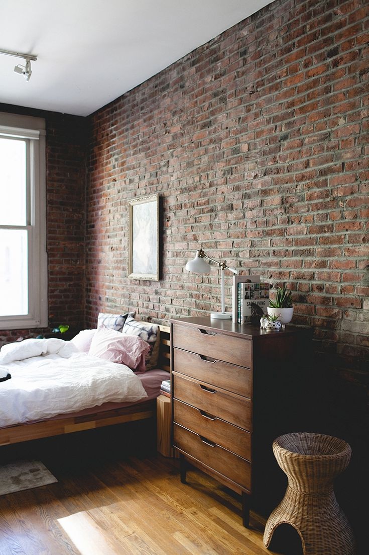 quarto com parede de tijolinhos aparentes